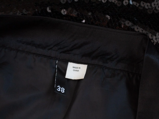 38/M Černá dámská sukně zdobená flitry H&M